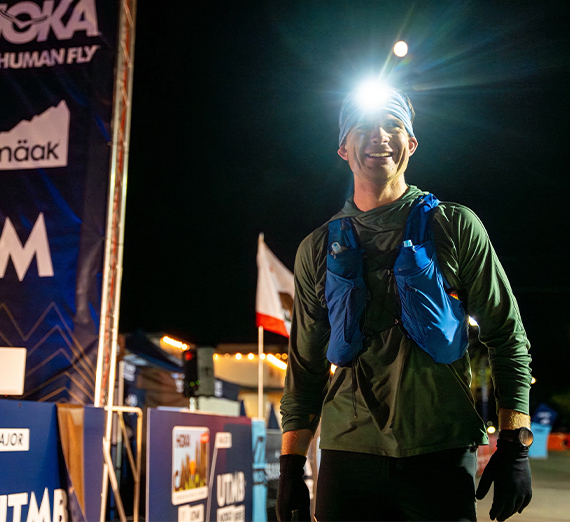 two women and two men stand on stairs